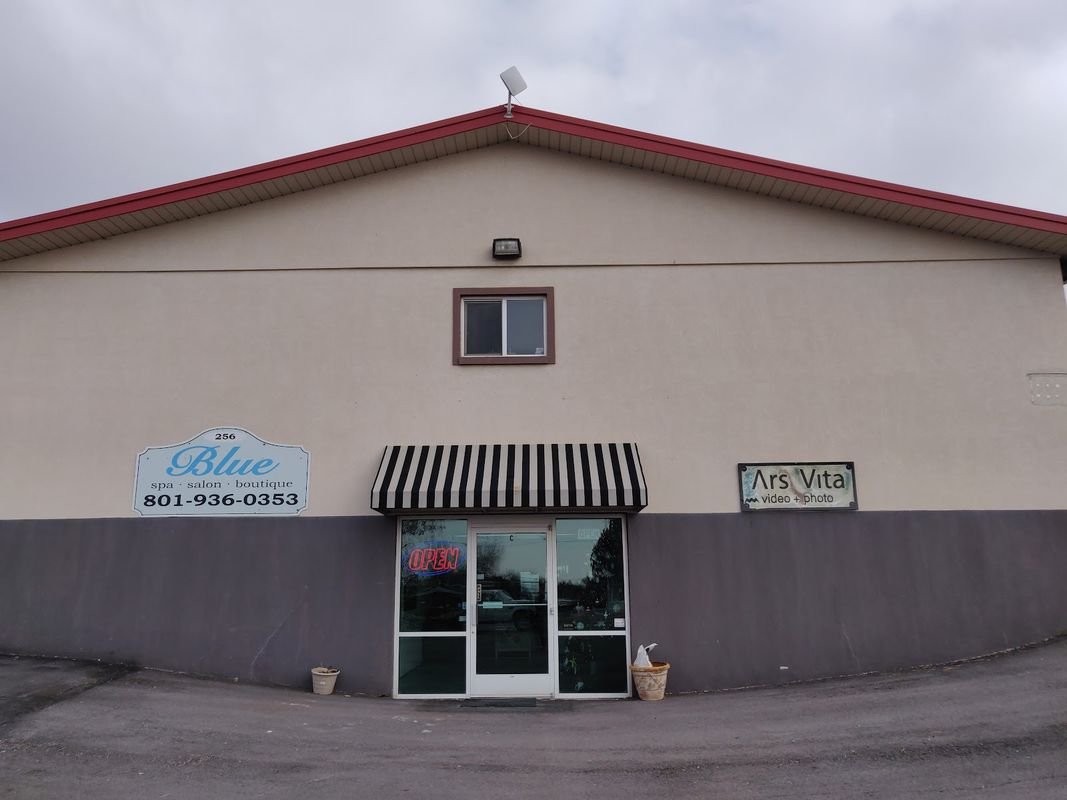 The Blue Salon building on Highway 89 at dusk