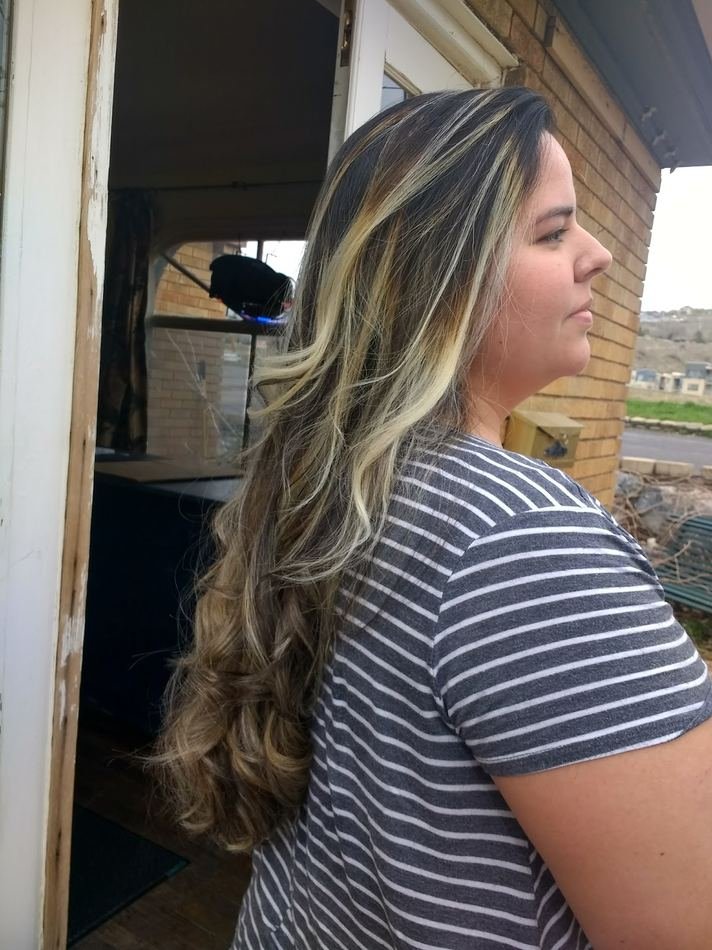Long blonde highlights with loose curls