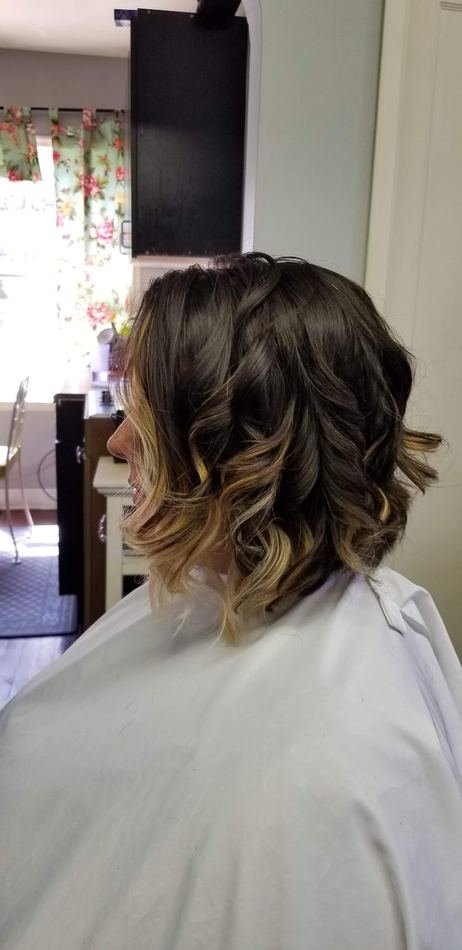 Shoulder-length cut with soft curls